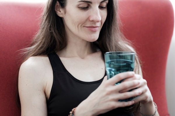 beautiful girl holding a glass of water